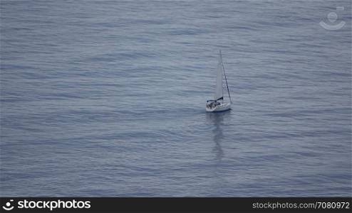 A sailboat off the Spanish coast