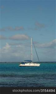 A sailboat on the sea, Moorea, Tahiti, French Polynesia, South Pacific