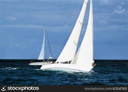 A sailboat participates in the Heiniken Regatta on the Dutch side of the island of St. Maarten in the Caribbean.