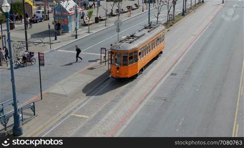 A San Francisco Municipal train unloads passengers and leaves