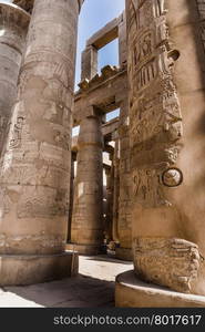 A sandstone column in Egypt. columns covered in hieroglyphics