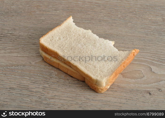 A sandwich with a bite taken out of it