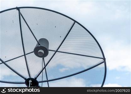 A Satellite dish on roof in blue sky with cloud Background