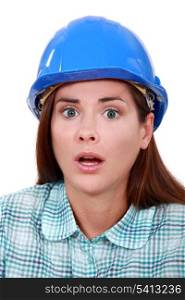 A scared female construction worker.