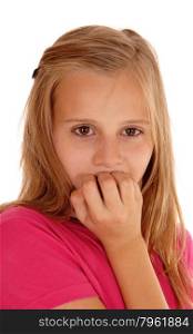 A scaret young girl in a pink sweater in a closeup picture biting herfingernails, isolated for white background.