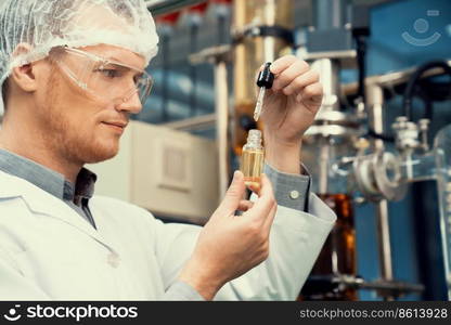 A scientist or apothecary extracts CBD hemp oil for medicinal purposes in a laboratory. Alternative cannabis-based medicine produced from cannabis extraction machine.. Scientist or apothecary extract CBD hemp oil for medicinal purpose in laboratory