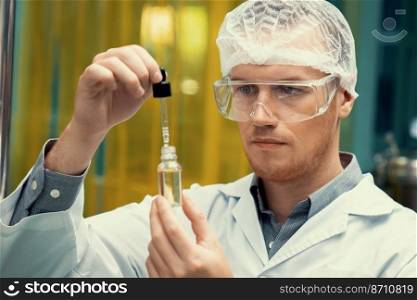 A scientist or apothecary extracts CBD hemp oil for medicinal purposes in a laboratory. Alternative cannabis-based medicine produced from cannabis extraction machine.. Scientist or apothecary extract CBD hemp oil for medicinal purpose in laboratory