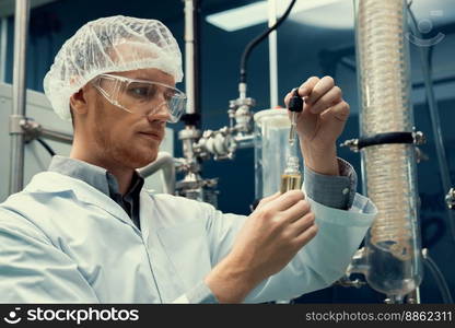 A scientist or apothecary extracts CBD hemp oil for medicinal purposes in a laboratory. Alternative cannabis-based medicine produced from cannabis extraction machine.. Scientist or apothecary extract CBD hemp oil for medicinal purpose in laboratory