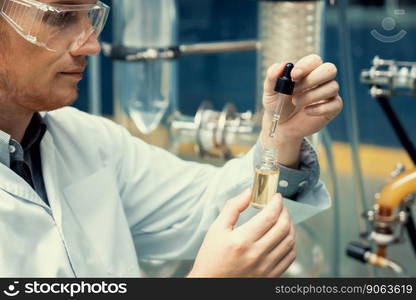 A scientist or apothecary extracts CBD hemp oil for medicinal purposes in a laboratory. Alternative cannabis-based medicine produced from cannabis extraction machine.. Scientist or apothecary extract CBD hemp oil for medicinal purpose in laboratory