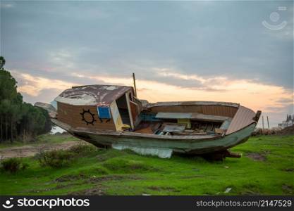 A scrapped wooden old rowboat