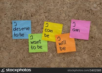 a scripts for self-help, personal change and fulfilment presented with color sticky notes on cork bulletin board