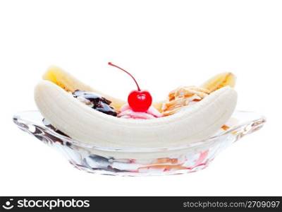 A scrumptious banana split, topped with caramel, strawberry, and chocolate, with a cherry garnish. Shot on white background.