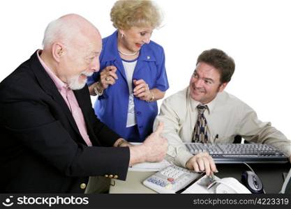 A senior couple giving their accountant thumbsup for doing a great job on their taxes. Isolated on white. Focus is on the senior man.