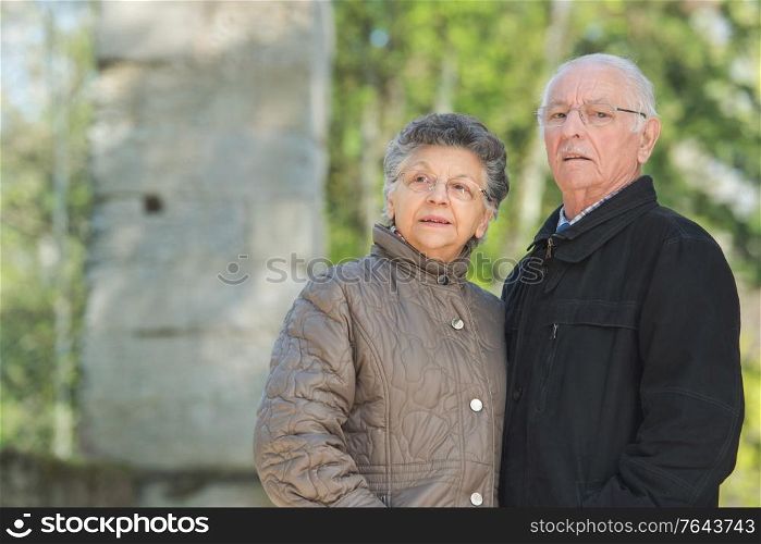a senior couple is outdoors