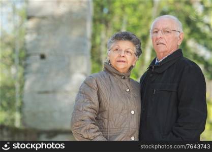 a senior couple is outdoors