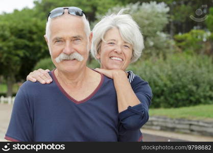 a senior couple is outdoors