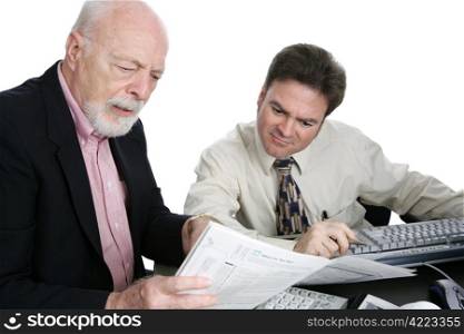 A senior man confused the his tax forms and seeking advice from an accountant. Isolated on white.