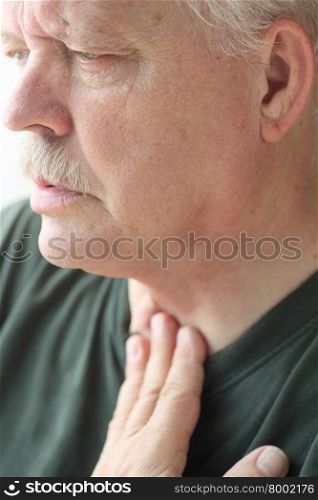 A senior man experiences a problem with his breathing.