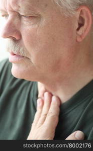 A senior man experiences a problem with his breathing.