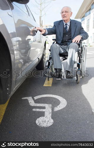 a senior man in wheelchair