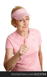 A senior woman dressed for Breast Cancer Awareness giving a thumbsup sign. Isolated on white.