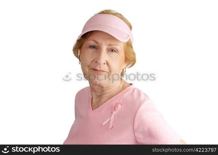 A senior woman dressed in pink and wearing a breast cancer awareness ribbon. Isolated on white.