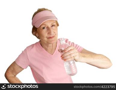 A senior woman in pink for breast cancer awareness drinking water. Isolated on white.