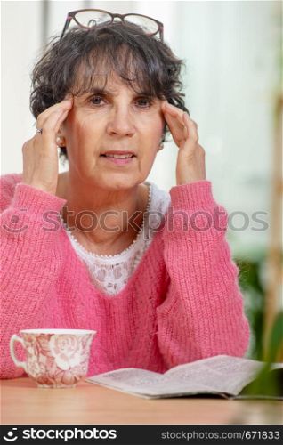 a senior woman with eyes ache