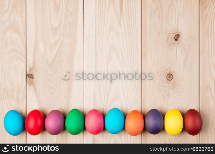 a series Easter eggs and a wooden background for an inscription