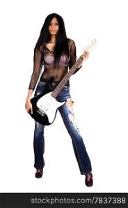 A serious looking Hispanic woman standing isolated for white background holding her guitar, in ripped jeans.