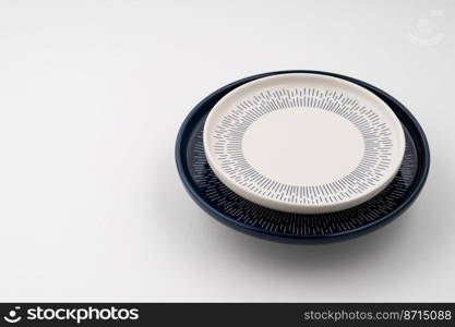 A set of blue and white luxury ceramic kitchen utensils on a white background. Set of blue and white luxury ceramic kitchen utensils on a white background