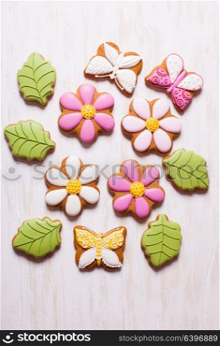 A set of delicious homemade gingerbreads of various shapes laid out on the table. Sweet holiday gingerbreads