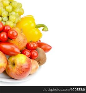 A set of fruits and vegetables on a platter isolated on white background. Free space for text.