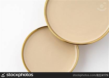 A set of light brown ceramic plate on a white background. Top view. Set of light brown ceramic plate on a white background