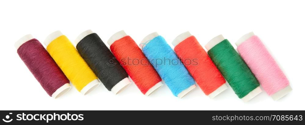 A set of sewing thread isolated on a white background. Wide photo.