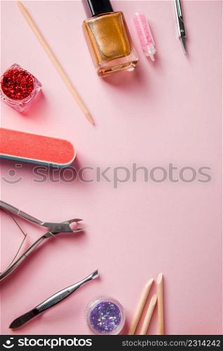 A set of tools for manicure and nail care on a pink background. Workplace in a beauty salon. Place for text.. A set of tools for manicure and nail care on pink background. Workplace in a beauty salon. Place for text.