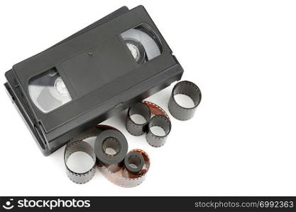 A set of video tapes and photographic film isolated on white background. Retro equipment. Flat lay,top view. Free space for text.
