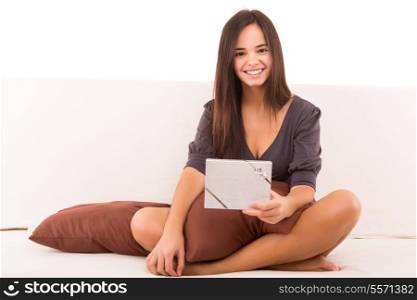 A sexy asian woman lying on her couch with a gift - Christmas or Birthday concept