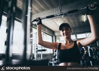 A sexy woman exercising in the sport gym