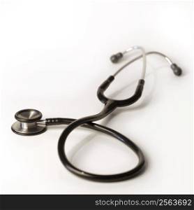 A shallow depth-of-field image of a stethoscope on white background.