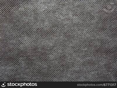 A sheet of thick, coarsely woven fabric in dark grey colour.Texture and background.Horizontal view.