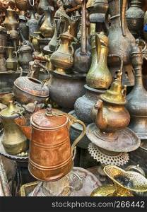 A shop in the Old City of Jerusalem displays a number of kettles and teapots of different sizes.