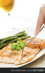 A shot of a baked salmon with string beans