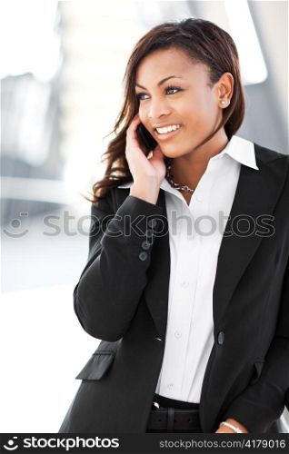A shot of a beautiful black businesswoman on the phone