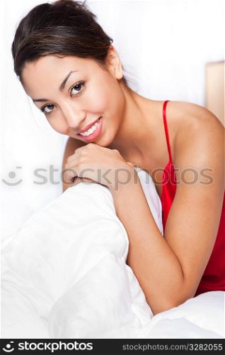 A shot of a beautiful black woman on her bed