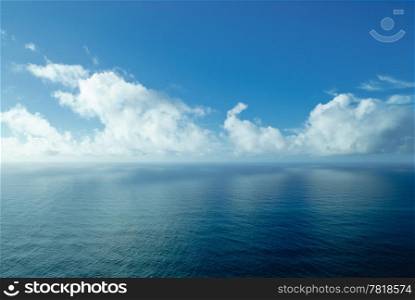 A shot of a beautiful blue sky reflected on the sea.