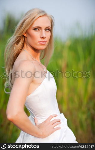 A shot of a beautiful caucasian bride outdoor