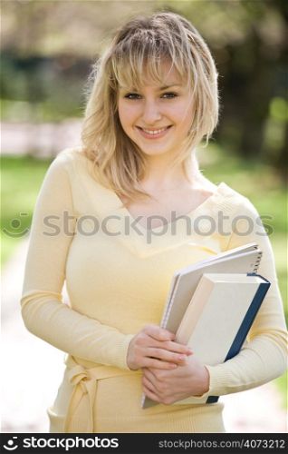 A shot of a beautiful caucasian college student on campus