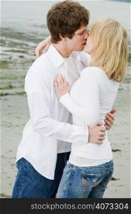 A shot of a beautiful caucasian couple kissing