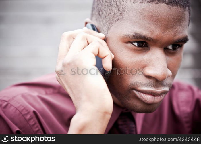 A shot of a black businessman on the phone